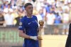 Chelsea's Cole Palmer (10) holds the golden ball trophy following the Club World Cup final soccer match between Chelsea and PSG in East Rutherford, N.J., Sunday, July 13, 2025. (AP Photo/Seth Wenig)