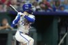 Kansas City Royals' Kyle Isbel watches his three-run double during the sixth inning of a baseball game against the Atlanta Braves, Tuesday, July 29, 2025, in Kansas City, Mo. (AP Photo/Charlie Riedel)