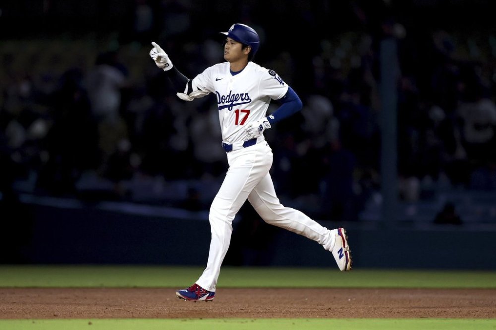 Los Angeles Dodgers designated hitter Shohei Ohtani runs the bases after hitting a home run during the ninth inning of a baseball game against the Minnesota Twins Tuesday, July 22, 2025, in Los Angeles. (AP Photo/Eric Thayer)