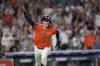Houston Astros' Zack Short celebrates after hitting a game-winning RBI single against the Texas Rangers during the 11th inning of a baseball game Saturday, July 12, 2025, in Houston. (AP Photo/David J. Phillip)