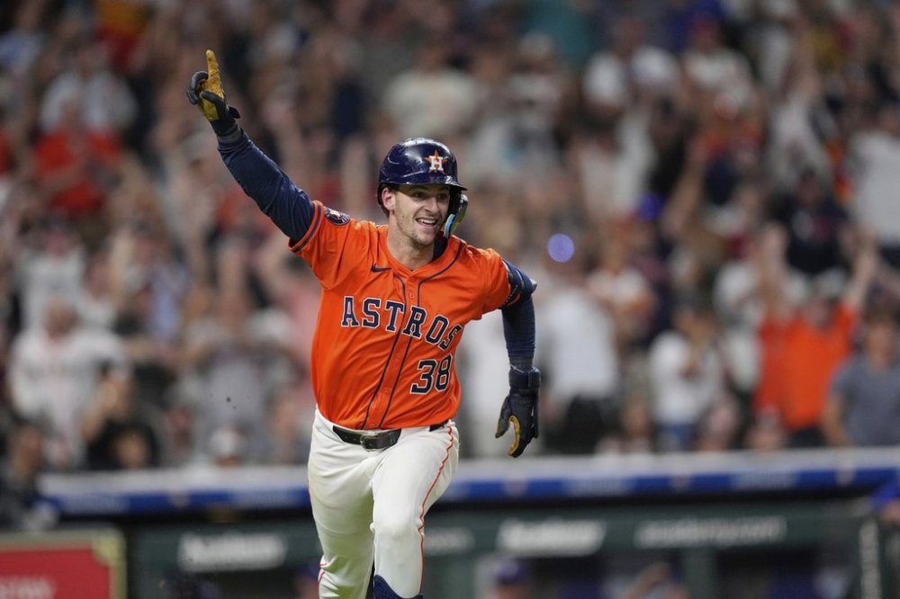 Houston Astros' Zack Short celebrates after hitting a game-winning RBI single against the Texas Rangers during the 11th inning of a baseball game Saturday, July 12, 2025, in Houston. (AP Photo/David J. Phillip)