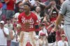 Cincinnati Reds' Will Benson (30) celebrates after hitting an RBI triple during the ninth inning of a baseball game against the Colorado Rockies, Saturday, July 12, 2025, in Cincinnati. (AP Photo/Joe Maiorana)