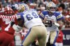 Winnipeg Blue Bombers quarterback Zach Collaros, right, looks for a receiver as Calgary Stampeders' Folarin Orimolade closes in during first half CFL football action in Calgary, Thursday, July 3, 2025. THE CANADIAN PRESS/Jeff McIntosh