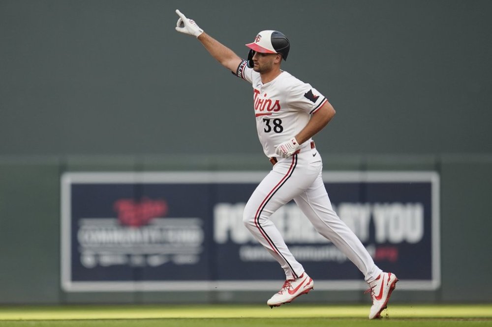 Minnesota Twins' Matt Wallner (38) runs the bases after hitting a solo home run during the second inning of a baseball game against the Chicago Cubs, Wednesday, July 9, 2025, in Minneapolis. (AP Photo/Abbie Parr)