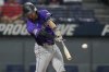 Colorado Rockies' Tyler Freeman hits an RBI single in the fifth inning of a baseball game against the Cleveland Guardians in Cleveland, Monday, July 28, 2025. (AP Photo/Sue Ogrocki)