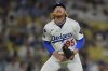 Los Angeles Dodgers starting pitcher Dustin May reacts after giving up a single to Minnesota Twins' Matt Wallner during the eighth inning of a baseball game Monday, July 21, 2025, in Los Angeles. (AP Photo/Jayne Kamin-Oncea)