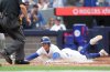 Toronto Blue Jays third base Ernie Clement (22) is safe a home plate during sixth inning MLB action against the San Francisco Giants in Toronto on Saturday, July 19, 2025. THE CANADIAN PRESS/Nathan Denette