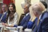 Homeland Security Secretary Kristi Noem, left, speaking as President Donald Trump, far right, listens during a cabinet meeting at the White House, Tuesday, July 8, 2025, in Washington. (AP Photo/Evan Vucci)