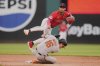 Cleveland Guardians shortstop Brayan Rocchio, top, jumps over a sliding Baltimore Orioles' Coby Mayo (16) after forcing Mayo out at second base and completing the throw to first base for the out on Jacob Stallings for a double play in the fifth inning of a baseball game in Cleveland, Tuesday, July 22, 2025. (AP Photo/Sue Ogrocki)