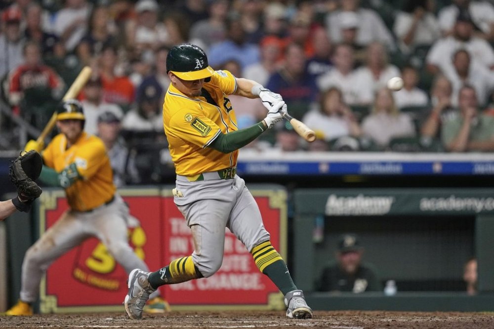 Athletics' Luis Urías hits home run against the Houston Astros during the sixth inning of a baseball game Thursday, July 24, 2025, in Houston. (AP Photo/David J. Phillip)