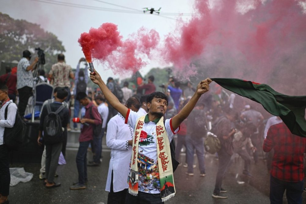Students use color sprays as they gather to commemorate