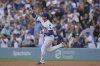 Los Angeles Dodgers pitcher Shohei Ohtani gestures after hitting a two-run home run during the first inning of a baseball game against the Minnesota Twins in Los Angeles, Monday, July 21, 2025. (AP Photo/Jayne Kamin-Oncea)