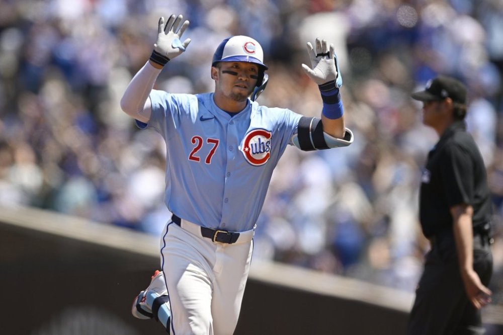 Chicago Cubs' Seiya Suzuki celebrates while rounding the bases after hitting a three-run home run during the first inning of a baseball game against the Boston Red Sox, Friday, July 18, 2025, in Chicago. (AP Photo/Paul Beaty)