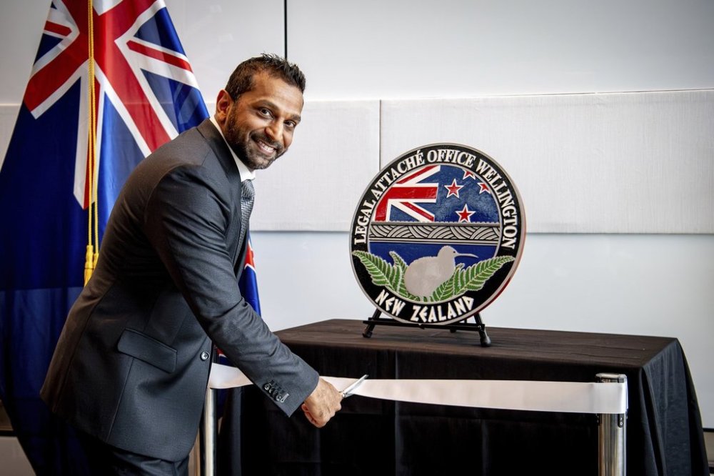 In this photo released by the US Embassy in Wellington, New Zealand, FBI Director Kash Patel cuts the ribbon at the official opening of the FBI office in Wellington, New Zealand, Thursday, July 31, 2025. (Ola Thorsen/US Embassy via AP)