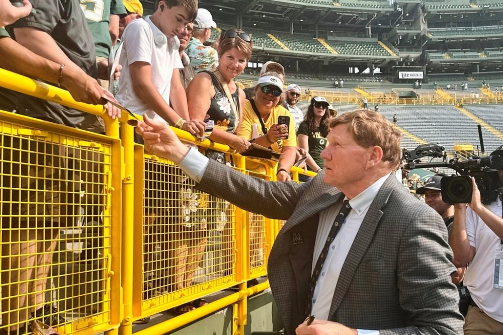 Mark Murphy signs autographs for fans on his final day as the Green Bay Packers' president/CEO at the NFL football team's annual shareholders meeting, Friday, July 25, 2025, in Green Bay, Wis. (AP Photo/Steve Megargee)