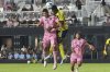 Inter Miami forward Luis Suarez (9) heads the ball against Nashville SC defender Jeisson Palacios (4) during the second half of an MLS soccer match, Saturday, July 12, 2025, in Fort Lauderdale, Fla. (AP Photo/Lynne Sladky)
