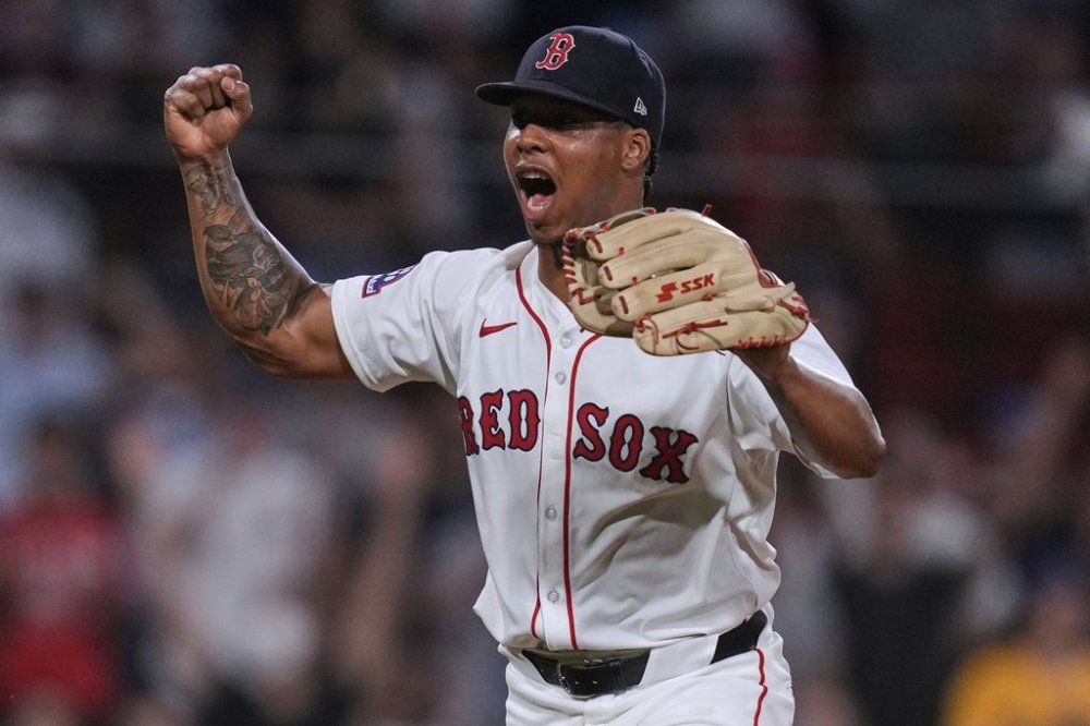 Boston Red Sox pitcher Brayan Bello celebrates after getting the win, throwing a complete game against the Colorado Rockies after a baseball game at Fenway Park, Tuesday, July 8, 2025, in Boston. (AP Photo/Charles Krupa)