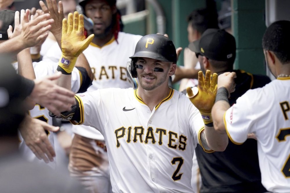 Pittsburgh Pirates' Spencer Horwitz celebrates in the dugout after hitting a grand slam during the second inning of a baseball game against the Detroit Tigers, Wednesday, July 23, 2025, in Pittsburgh. (AP Photo/Matt Freed)