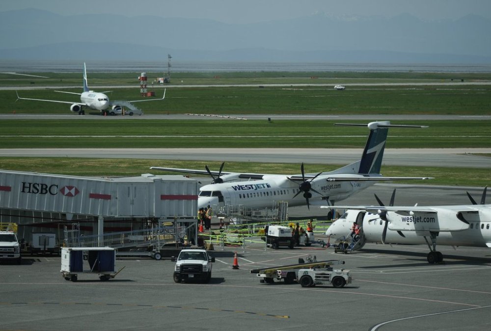 WestJet aircraft air prepared for departure at Vancouver International Airport, in Richmond, B.C., on Friday, May 19, 2023. THE CANADIAN PRESS/Darryl Dyck