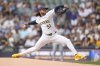 Milwaukee Brewers' Freddy Peralta pitches during the first inning of a baseball game against the Washington Nationals, Sunday, July 13, 2025, in Milwaukee. (AP Photo/Aaron Gash)