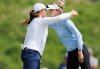 Lottie Woad, left, and Nelly Korda embrace after completing the first round of the women's Scottish Open golf tournament, Thursday, July 24, 2025, at Dundonald Links in Irvine, Scotland. (Steve Welsh/PA via AP)