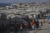 A camp of tents housing displaced Palestinians extends across Gaza City, Thursday, July 17, 2025. (AP Photo/Jehad Alshrafi)