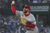 Cincinnati Reds starting pitcher Zack Littell throws against the Chicago Cubs during the first inning of a baseball game in Chicago, Tuesday, Aug. 5, 2025. (AP Photo/Nam Y. Huh)