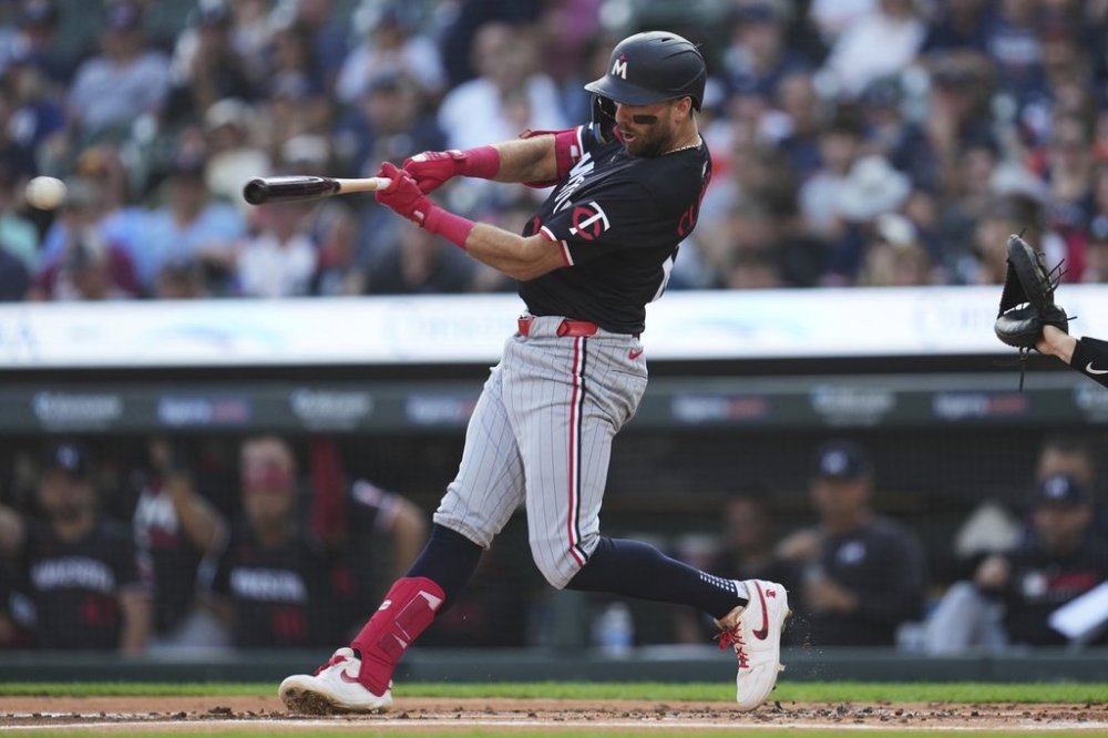 Minnesota Twins' Kody Clemens hits a one-run double against the Detroit Tigers in the first inning during a baseball game Tuesday, Aug. 5, 2025, in Detroit. (AP Photo/Paul Sancya)