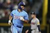 Texas Rangers' Josh Smith rounds the bases after hitting a two-run home run against the Atlanta Braves in the second inning of a baseball game Sunday, July 27, 2025, in Arlington, Texas. (AP Photo/Tony Gutierrez)