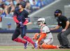Toronto Blue Jays' George Springer (left) hits a single as San Francisco Giants catcher Patrick Bailey (14) looks on during first inning MLB baseball action in Toronto on Friday, July 18, 2025. THE CANADIAN PRESS/Nathan Denette