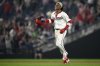 Washington Nationals' CJ Abrams celebrates after he hit a walk-off single to score Robert Hassell III for the game-winning run during the ninth inning of a baseball game against the Athletics, Wednesday, Aug. 6, 2025, in Washington. (AP Photo/Nick Wass)