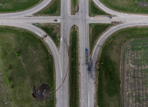 A scorched patch of ground where a bus carrying seniors ended up after colliding with a transport truck and burning on Thursday is seen on the edge of the Trans-Canada Highway where it intersects with Hwy 5, west of Winnipeg near Carberry, Man., Friday, June 16, 2023. THE CANADIAN PRESS/Darryl Dyck