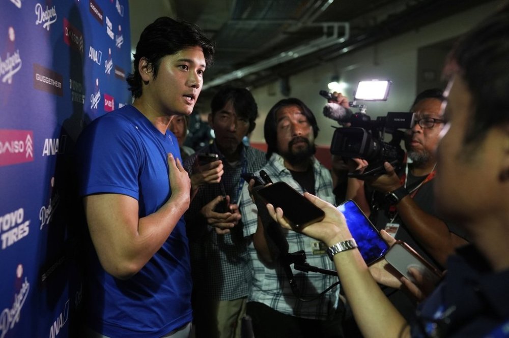 Los Angeles Dodgers' Shohei Ohtani talks to the media after a baseball game against the Cincinnati Reds Wednesday, July 30, 2025, in Cincinnati. (AP Photo/Carolyn Kaster)