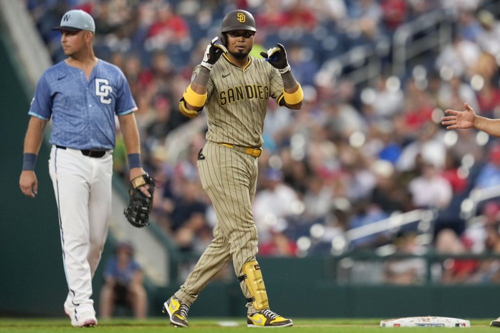 San Diego Padres' Luis Arraez (4) gestures after hitting a single against the Washington Nationals during the third inning of a baseball game at Nationals Park, Friday, July 18, 2025, in Washington. (AP Photo/Jess Rapfogel)
