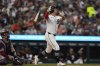 Detroit Tigers' Kerry Carpenter tosses his bat after hitting a go-ahead two-run home run during the sixth inning of a baseball game against the Minnesota Twins, Monday, Aug. 4, 2025, in Detroit. (AP Photo/Ryan Sun)