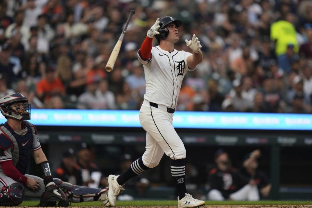 Detroit Tigers' Kerry Carpenter tosses his bat after hitting a go-ahead two-run home run during the sixth inning of a baseball game against the Minnesota Twins, Monday, Aug. 4, 2025, in Detroit. (AP Photo/Ryan Sun)