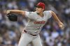 Cincinnati Reds starter Nick Lodolo delivers a pitch during the first inning of a baseball game against the Chicago Cubs Monday, Aug. 4, 2025, in Chicago. (AP Photo/Paul Beaty)
