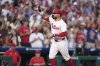 Philadelphia Phillies' Kyle Schwarber reacts after hitting a grand slam against Los Angeles Angels pitcher José Fermin during the sixth inning of a baseball game Saturday, July 19, 2025, in Philadelphia. (AP Photo/Matt Slocum)