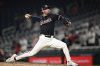 Washington Nationals pitcher Kyle Finnegan throws during the ninth inning of a baseball game against the Cincinnati Reds in Washington, Monday, July 21, 2025. (AP Photo/Terrance Williams)