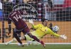 Colorado Rapids forward Calvin Harris (14) scores past Vancouver Whitecaps goalkeeper Yohei Takaoka, right, in the first half of an MLS soccer match Saturday, July 12, 2025, in Commerce City, Colo. (AP Photo/David Zalubowski)