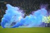 FILE - Soccer fans use a flare during the English Premier League soccer match between Everton and Liverpool, Liverpool, England, Wednesday, Feb.12, 2025. (AP Photo/Dave Thompson, File)