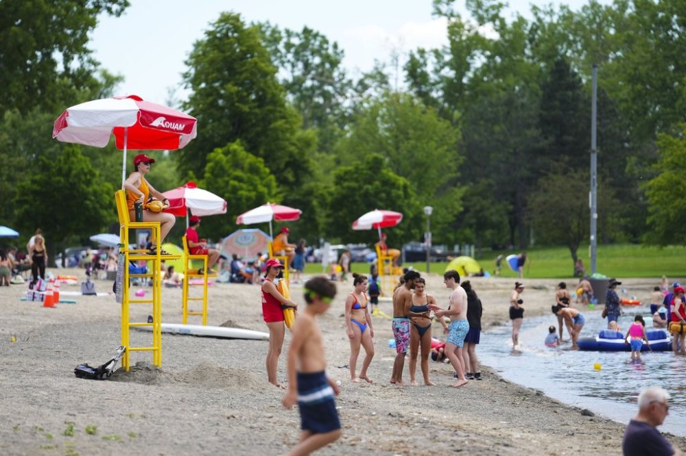 Lifeguards work at Britannia Beach of the Ottawa River in Ottawa on Friday, June 24, 2022. THE CANADIAN PRESS/Sean Kilpatrick
