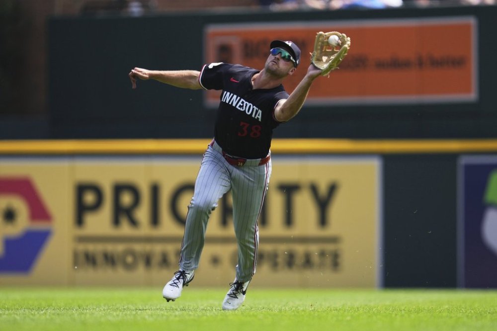 Minnesota Twins right fielder Matt Wallner catches a Detroit Tigers' Matt Vierling fly ball on the run in the fifth inning during a baseball game Wednesday, Aug. 6, 2025, in Detroit. (AP Photo/Paul Sancya)