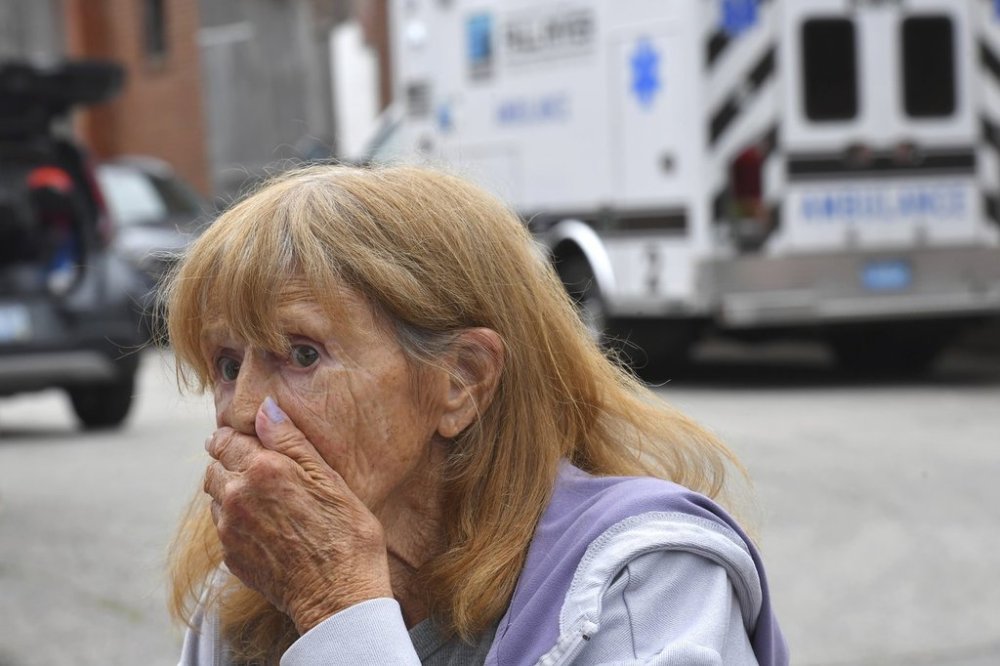 Donna Murphy, a resident at the Gabriel House assisted living facility, in Fall River, Mass., speaks with members of the media outside a temporary shelter, Monday, July 14, 2025, in Fall River, Mass., following a fire at the Gabriel House that started late Sunday and resulted in multiple fatalities. (AP Photo/Steven Senne)
