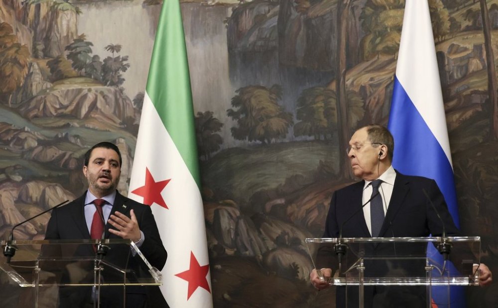 Russian Foreign Minister Sergey Lavrov, right, and Syrian Foreign Minister Asaad Hassan al-Shibani, left, attend a joint news conference following their meeting in Moscow, Russia, Thursday, July 31, 2025. (Shamil Zhumatov/ Pool Photo via AP)