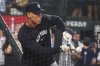 New York Yankees outfielder Aaron Judge bunts during batting practice before a baseball game against the Texas Rangers, Tuesday, Aug. 5, 2025, in Arlington, Texas. (AP Photo/LM Otero)