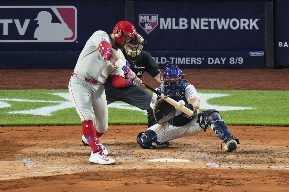 Philadelphia Phillies' Kyle Schwarber hits a two-run home run during the fifth inning of a baseball game against the New York Yankees Friday, July 25, 2025, in New York. (AP Photo/Frank Franklin II)