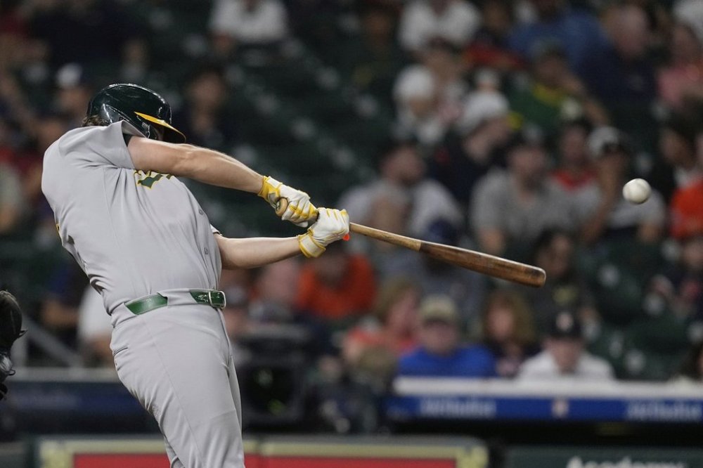 Athletics' Nick Kurtz hits a home run against the Houston Astros during the eighth inning of a baseball game Friday, July 25, 2025, in Houston. (AP Photo/David J. Phillip)