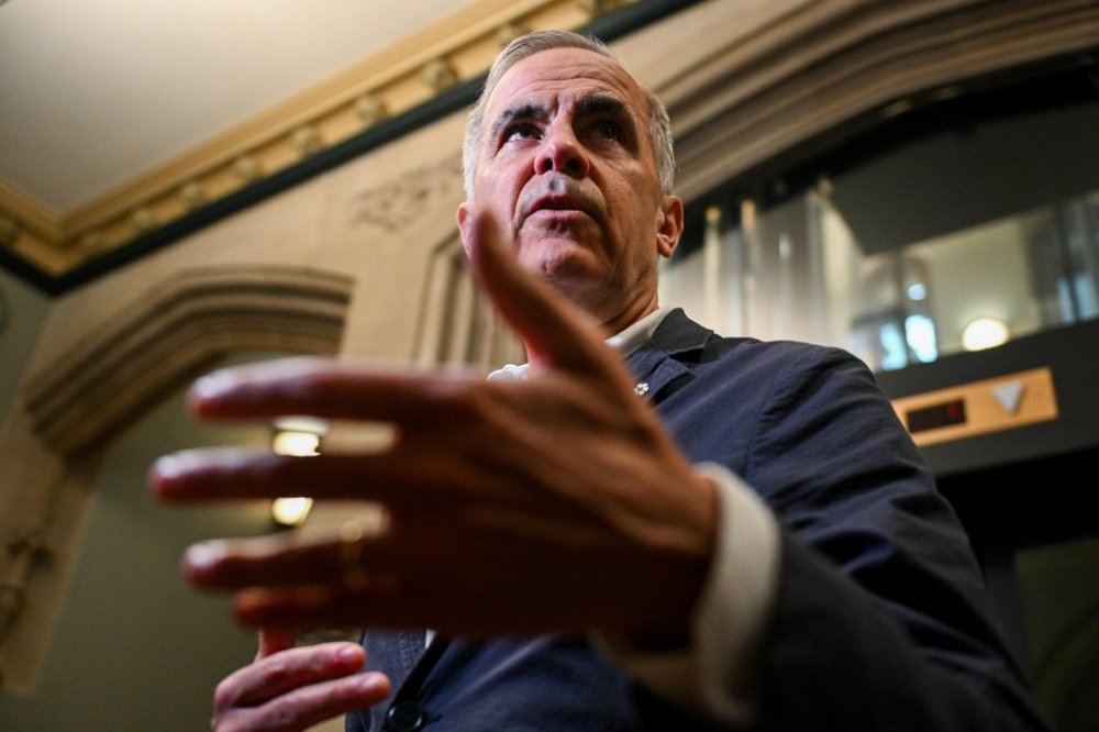 Prime Minister Mark Carney speaks with reporters Parliament Hill in Ottawa on Monday, June 30, 2025. THE CANADIAN PRESS/Spencer Colby
