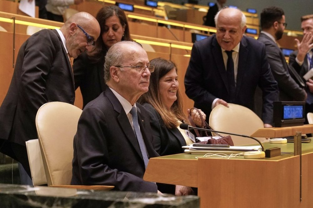 Palestine Prime Minister Mohammed Mustafa, foreground, arrives to address the United Nations General Assembly, Monday, July 28, 2025. (AP Photo/Richard Drew)